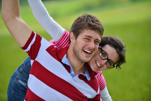 Portrait of romantic young couple smiling together outdoor photo
