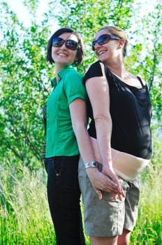 woman pragnant outdoor with friend photo