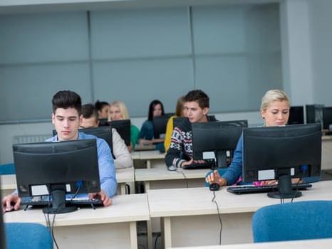students group in computer lab classroom photo