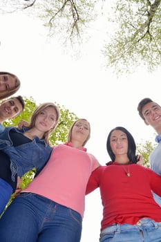 young friends staying together outdoor in the park photo