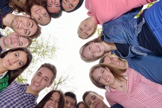 young friends staying together outdoor in the park photo