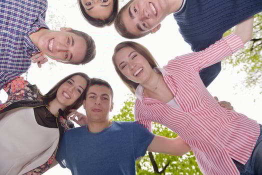 young friends staying together outdoor in the park photo