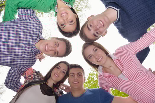 young friends staying together outdoor in the park photo