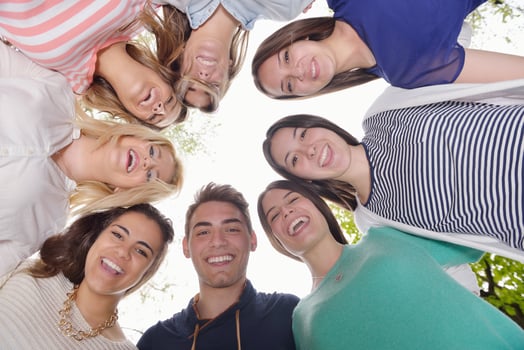 young friends staying together outdoor in the park photo
