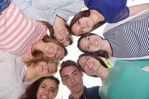 young friends staying together outdoor in the park photo