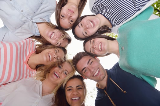young friends staying together outdoor in the park photo