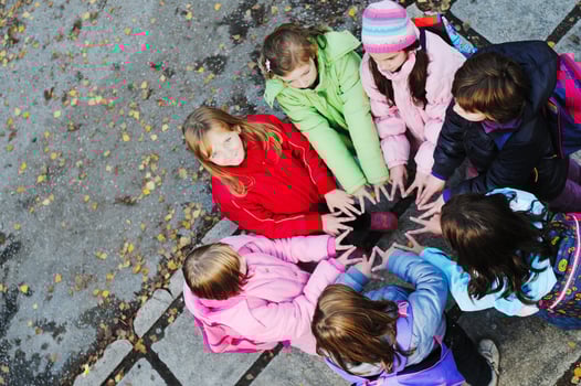 friendship and teamwork concept with young schoolgirls group photo