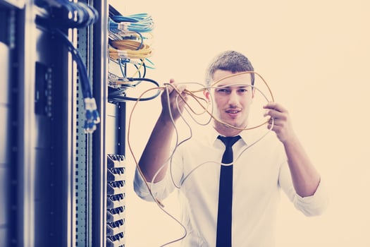 young it engeneer in datacenter server room photo