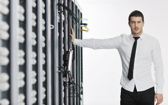 young it engeneer in datacenter server room photo