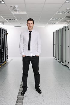 young it engeneer in datacenter server room photo