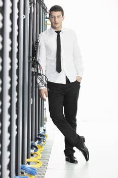 young it engeneer in datacenter server room photo