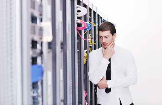 young it engeneer in datacenter server room photo