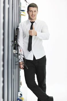 young it engeneer in datacenter server room photo