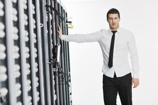 young it engeneer in datacenter server room photo
