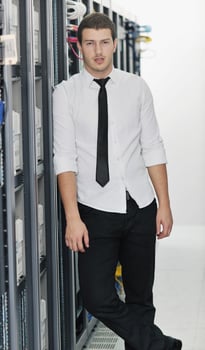young it engeneer in datacenter server room photo