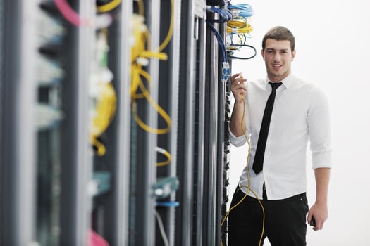 young it engeneer in datacenter server room photo