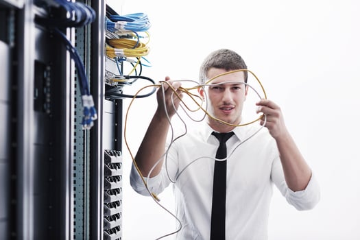 young it engeneer in datacenter server room photo