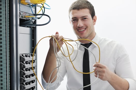 young it engeneer in datacenter server room photo