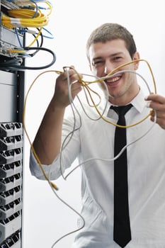 young it engeneer in datacenter server room photo