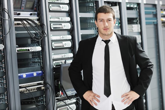young it engeneer in datacenter server room photo