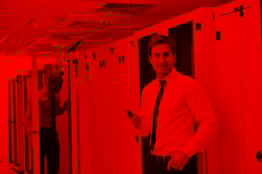 it enineers in network server room photo