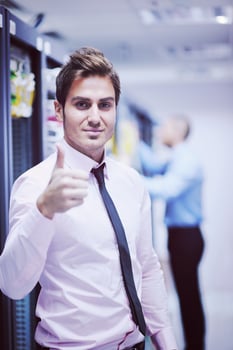 it engineers in network server room photo