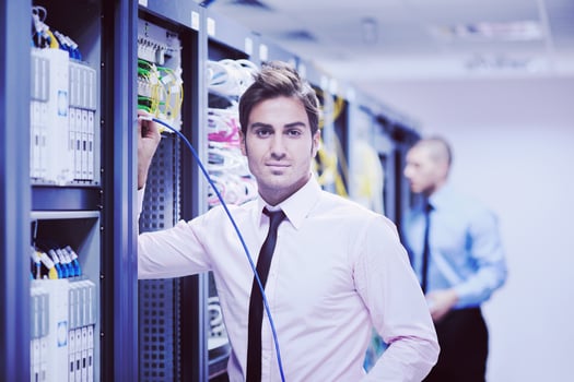 it engineers in network server room photo