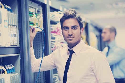it engineers in network server room photo