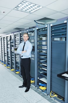 young it engeneer in datacenter server room photo