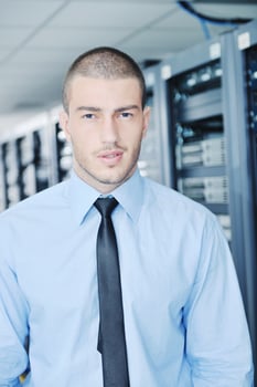 young it engeneer in datacenter server room photo