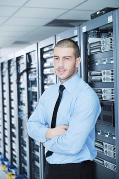 young it engeneer in datacenter server room photo
