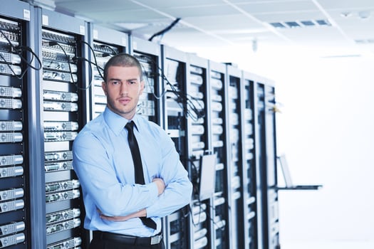 young it engeneer in datacenter server room photo
