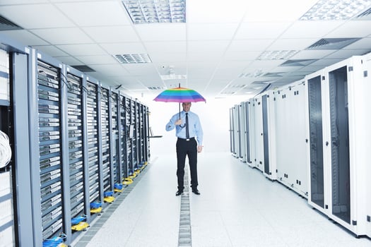 businessman hold umbrella in server room photo