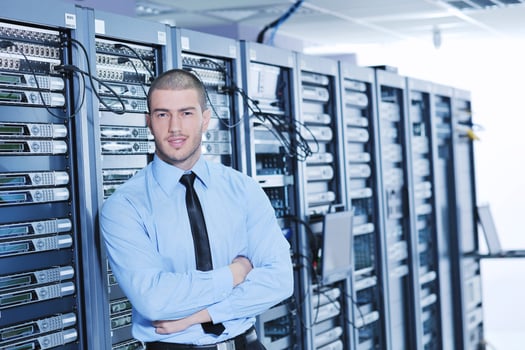 young it engeneer in datacenter server room photo