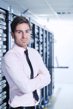 young it engeneer in datacenter server room photo