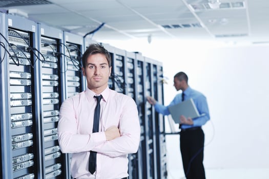 it engineers in network server room photo