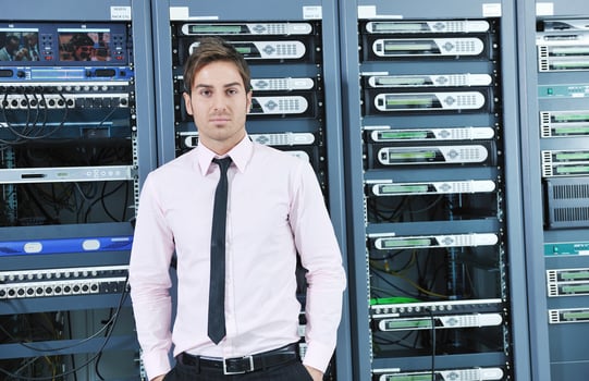 young it engeneer in datacenter server room photo