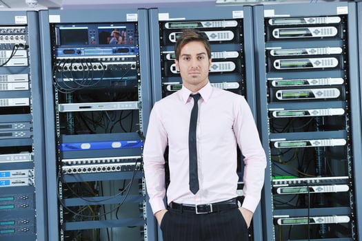 young it engeneer in datacenter server room photo