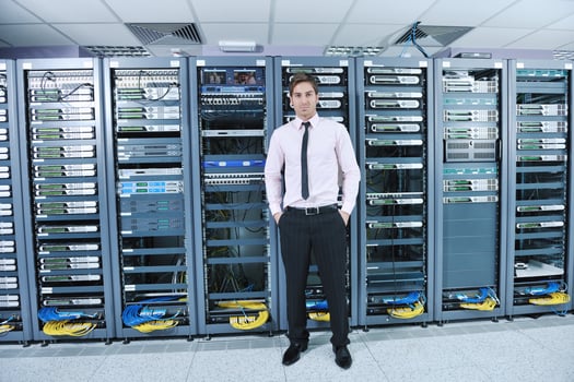 young it engeneer in datacenter server room photo
