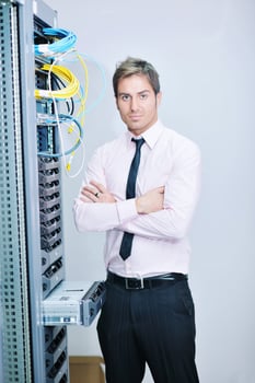young it engeneer in datacenter server room photo