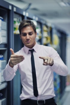 young it engeneer in datacenter server room photo