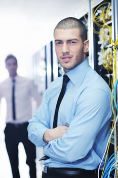 it engineers in network server room photo