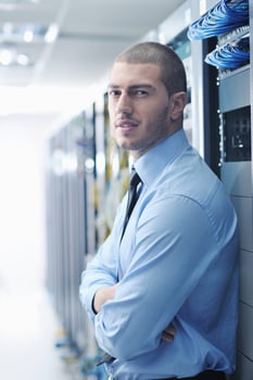 young it engeneer in datacenter server room photo