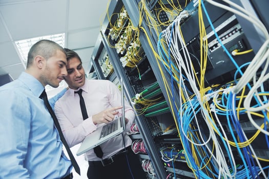 it engineers in network server room photo