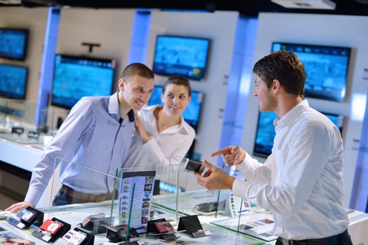 People in electronics store photo