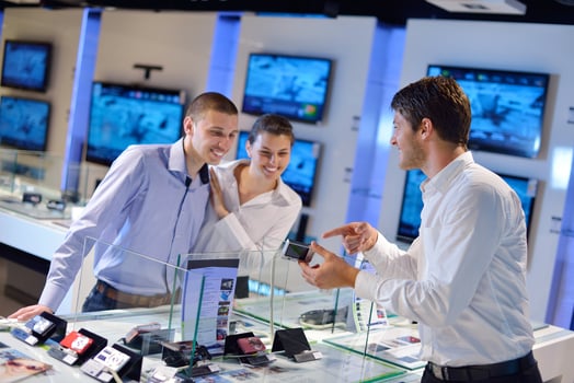 People in electronics store photo