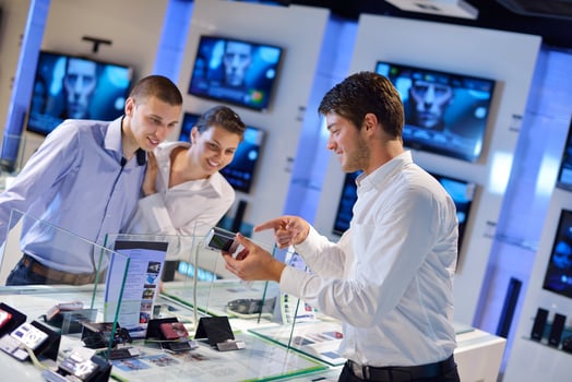 People in electronics store photo