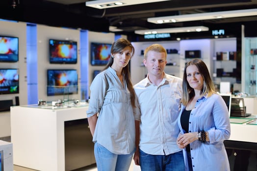 People in electronics store photo
