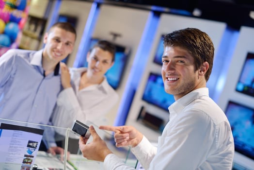People in electronics store photo