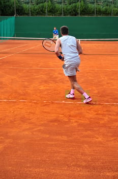 One man play tennis outdoors photo